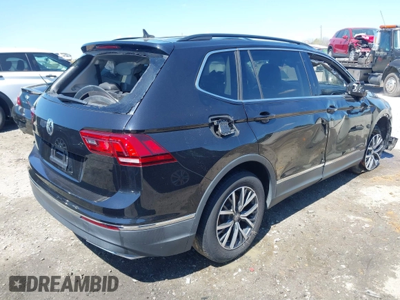 2020 Volkswagen Tiguan SE with VIN 3VV3B7AX1LM139519, listed as a IAAI auction lot 41890276 with 147,303 mi miles and . Bid and sale history available at DreamBid. Image 4.