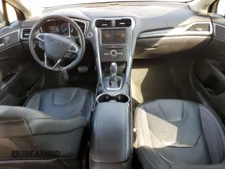 2016 Ford Fusion Titanium z VIN 3FA6P0K98GR151640, wystawiony jako Copart lot #73254594 z przebiegiem 145 473 mil mil oraz Szkoda całkowita • Salvage title. Historia ofert i sprzedaży dostępna na DreamBid. Obrazek 8.