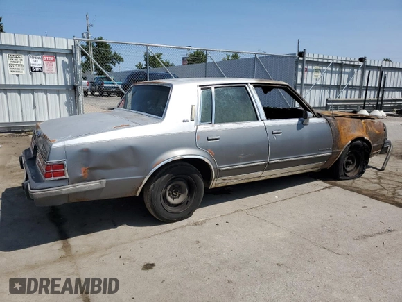 1986 Pontiac Bonneville Brougham z VIN 2G2GR69H9G2241181, wystawiony jako Copart lot #68122684 z przebiegiem Nie podano mil oraz Nie do naprawy • Non repairable. Historia ofert i sprzedaży dostępna na DreamBid. Obrazek 3.