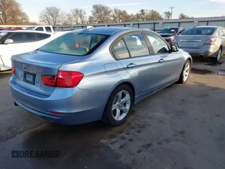 2013 BMW 3 Series 320i with VIN WBA3B1C56DK128089, listed as a IAAI auction lot 41332091 with 101,155 mi miles. Bid and sale history available at carsss.com. Image 3.