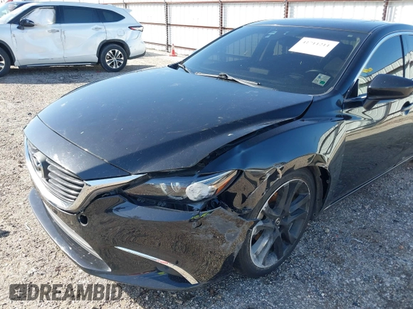 2016 Mazda 6 i Grand Touring with VIN JM1GJ1W50G1478699, listed as a IAAI auction lot 41711211 with 208,720 mi miles and . Bid and sale history available at DreamBid. Image 18.