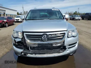 2010 Volkswagen Touareg VR6 with VIN WVGBF7A97AD004355, listed as a Copart auction lot 52861335 with 129,454 mi miles and Salvage Title. Bid and sale history available at DreamBid. Image 5.