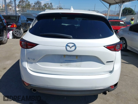 2020 Mazda CX-5 Grand Touring with VIN JM3KFADM0L1838495, listed as a IAAI auction lot 41991566 with 32,021 mi miles. Bid and sale history available at carsss.com. Image 16.