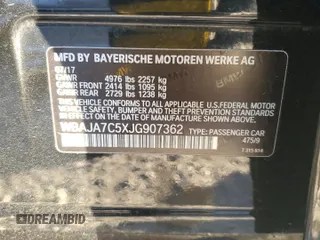 2018 BMW 5 Series 530i xDrive with VIN WBAJA7C5XJG907362, listed as a Copart auction lot 86715344 with 117,665 mi miles and Salvage title. Bid and sale history available at DreamBid. Image 12.