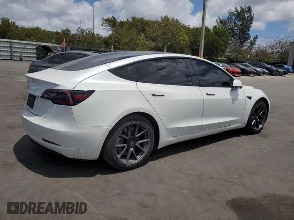 2021 Tesla Model 3 Standard Range Plus with VIN 5YJ3E1EA2MF985463, listed as a Copart auction lot 53311455 with 23,176 mi miles and Clean Title. Bid and sale history available at DreamBid. Image 3.