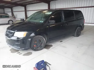 2013 Dodge Grand Caravan SXT with VIN 2C4RDGCG1DR527778, listed as a IAAI auction lot 41947721 with 115,886 mi miles. Bid and sale history available at carsss.com. Image 2.