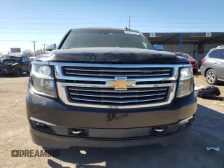 2015 Chevrolet Suburban LTZ with VIN 1GNSKKKC2FR634654, listed as a Copart auction lot 50337415 with 150,255 mi miles and Salvage Title. Bid and sale history available at DreamBid. Image 5.