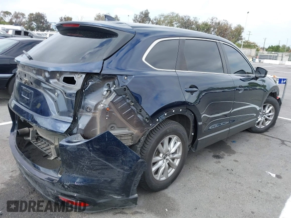 2016 Mazda CX-9 Sport with VIN JM3TCABY3G0123239, listed as a IAAI auction lot 42570700 with 119,414 mi miles and . Bid and sale history available at DreamBid. Image 4.