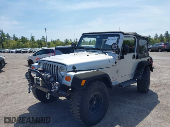 2003 Jeep Wrangler Sport z VIN 1J4FA49S73P302278, wystawiony jako IAAI lot #42219582 z przebiegiem 129 089 mil mil oraz . Historia ofert i sprzedaży dostępna na DreamBid. Obrazek 17.