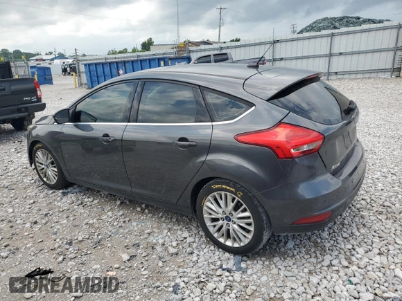 2017 Ford Focus Titanium z VIN 1FADP3N22HL307260, wystawiony jako Copart lot #61399785 z przebiegiem 103 293 mil mil oraz Szkoda całkowita • Salvage title. Historia ofert i sprzedaży dostępna na DreamBid. Obrazek 2.