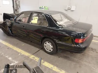 1994 Toyota Camry LE with VIN JT2SK12E3R0207215, listed as a IAAI auction lot 41788670 with 124,010 mi miles. Bid and sale history available at carsss.com. Image 3.
