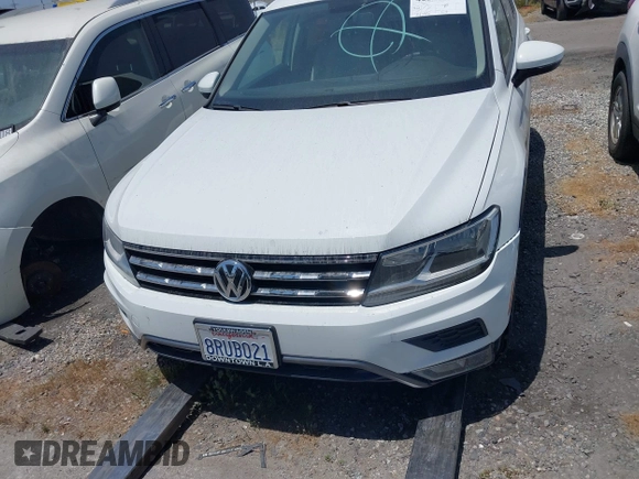 2018 Volkswagen Tiguan S with VIN 3VV1B7AX8JM032990, listed as a IAAI auction lot 42279807 with 74,185 mi miles and . Bid and sale history available at DreamBid. Image 13.