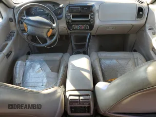 1997 Ford Explorer XL with VIN 1FMDU34E2VZC03015, listed as a Copart auction lot 80654764 with 295,587 mi miles and Salvage title. Bid and sale history available at DreamBid. Image 8.
