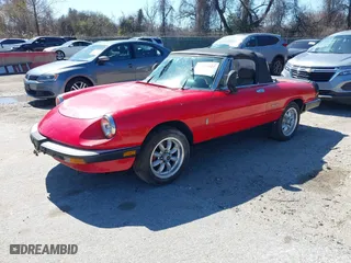 1989 Alfa Romeo Spider Graduate with VIN ZARBA5641K1063527, listed as a IAAI auction lot 41884427 with 107,243 mi miles. Bid and sale history available at carsss.com. Image 2.