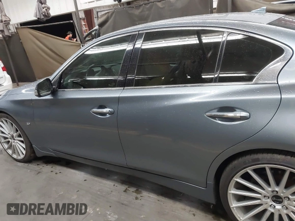 2015 Infiniti Q50 Premium z VIN JN1BV7AP6FM337369, wystawiony jako IAAI lot #41788419 z przebiegiem 106 977 mil mil oraz . Historia ofert i sprzedaży dostępna na DreamBid. Obrazek 14.