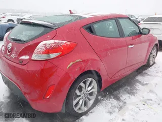 2014 Hyundai Veloster with VIN KMHTC6AD8EU214612, listed as a IAAI auction lot 41258820 with 61,984 mi miles. Bid and sale history available at carsss.com. Image 4.