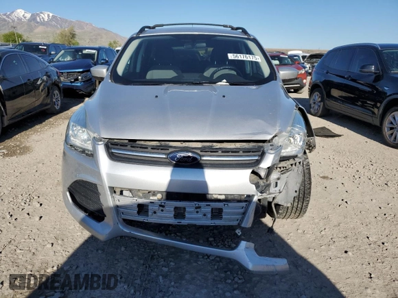 2013 Ford Escape SE z VIN 1FMCU9G96DUD12621, wystawiony jako Copart lot #56176175 z przebiegiem 85 597 mil mil oraz Szkoda całkowita • Salvage title. Historia ofert i sprzedaży dostępna na DreamBid. Obrazek 5.