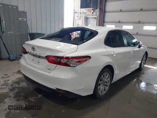 2019 Toyota Camry LE with VIN 4T1B11HK4KU853137, listed as a IAAI auction lot 41633785 with 67,629 mi miles and . Bid and sale history available at DreamBid. Image 4.