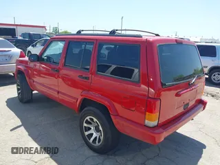 1998 Jeep Cherokee Sport with VIN 1J4FT68S2WL256846, listed as a IAAI auction lot 41998490 with 198,936 mi miles. Bid and sale history available at carsss.com. Image 3.