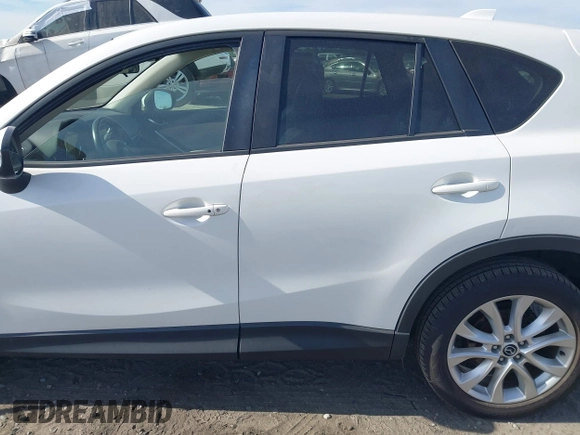 2015 Mazda CX-5 Grand Touring with VIN JM3KE2DY5F0498718, listed as a IAAI auction lot 42070000 with 129,327 mi miles. Bid and sale history available at carsss.com. Image 15.