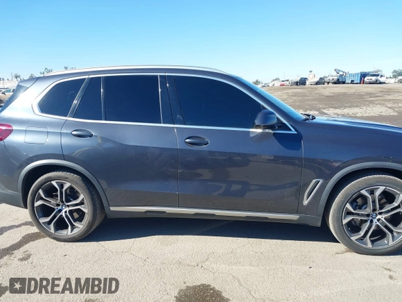 2021 BMW X5 sDrive40i with VIN 5UXCR4C08M9E15642, listed as a IAAI auction lot 41377524 with 76,050 mi miles. Bid and sale history available at carsss.com. Image 14.