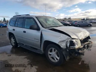 2006 GMC Envoy SLE with VIN 1GKDT13S262327772, listed as a Copart auction lot 85270134 with 242,390 mi miles and Salvage Title. Bid and sale history available at carsss.com. Image 4.