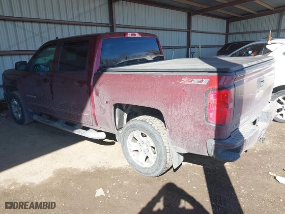 2016 Chevrolet Silverado 1500 LT with VIN 3GCUKREC9GG323309, listed as a IAAI auction lot 41653595 with 130,775 mi miles. Bid and sale history available at carsss.com. Image 3.