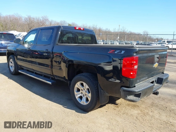 2018 Chevrolet Silverado 1500 LT with VIN 1GCUKREC3JF119906, listed as a IAAI auction lot 41765398 with 122,472 mi miles and . Bid and sale history available at DreamBid. Image 3.