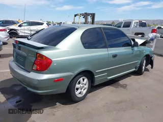 2003 Hyundai Accent GL with VIN KMHCG35C53U277734, listed as a IAAI auction lot 42085996 with 108,369 mi miles. Bid and sale history available at carsss.com. Image 4.