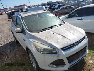 2015 Ford Escape Titanium with VIN 1FMCU0JX2FUA06571, listed as a IAAI auction lot 41855598 with 164,513 mi miles. Bid and sale history available at carsss.com. Image 1.