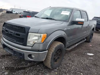2011 Ford F-150 XLT with VIN 1FTFW1ET4BFC23725, listed as a IAAI auction lot 42018932 with 323,160 mi miles. Bid and sale history available at carsss.com. Image 2.