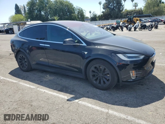 2017 Tesla Model X 90D with VIN 5YJXCBE20HF051099, listed as a Copart auction lot 52208205 with 118,828 mi miles and Salvage Title. Bid and sale history available at DreamBid. Image 4.