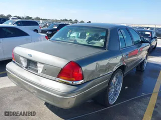 2002 Ford Crown Victoria Police Pkg Police Interceptor with VIN 2FAFP71W52X143053, listed as a IAAI auction lot 41594827 with 210,078 mi miles. Bid and sale history available at carsss.com. Image 4.