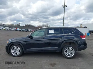 2019 Volkswagen Atlas SE z VIN 1V2UR2CA6KC580992, wystawiony jako IAAI lot #41902265 z przebiegiem 63 233 mil mil oraz . Historia ofert i sprzedaży dostępna na DreamBid. Obrazek 14.