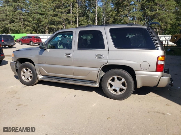 2002 GMC Yukon Denali with VIN 1GKEK63U72J274220, listed as a Copart auction lot 71891634 with 140,885 mi miles and Salvage Title. Bid and sale history available at carsss.com. Image 2.