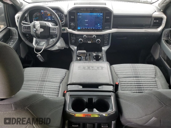 2023 Ford F-150 XL with VIN 1FTFW1E84PKE35275, listed as a Copart auction lot 61867535 with 22,142 mi miles and Salvage title. Bid and sale history available at DreamBid. Image 8.