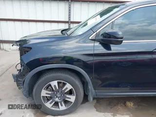 2017 Honda Ridgeline RTL z VIN 5FPYK2F55HB011463, wystawiony jako IAAI lot #42139030 z przebiegiem 59 066 mil mil oraz . Historia ofert i sprzedaży dostępna na DreamBid. Obrazek 19.