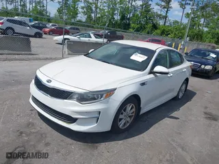 2016 Kia Optima LX with VIN KNAGT4L3XG5095972, listed as a IAAI auction lot 42130422 with 103,420 mi miles. Bid and sale history available at carsss.com. Image 2.