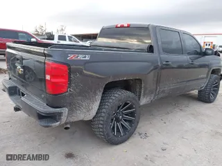 2016 Chevrolet Silverado 1500 LT with VIN 3GCUKREC0GG252047, listed as a IAAI auction lot 41004266 with 170,817 mi miles. Bid and sale history available at carsss.com. Image 4.