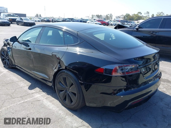 2022 Tesla Model S with VIN 5YJSA1E5XNF467435, listed as a IAAI auction lot 42538706 with 26,504 mi miles and . Bid and sale history available at DreamBid. Image 3.