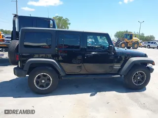 2013 Jeep Wrangler Unlimited Sport with VIN 1C4BJWDG7DL583686, listed as a IAAI auction lot 42037650 with 122,408 mi miles. Bid and sale history available at carsss.com. Image 14.