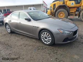 2014 Maserati Ghibli with VIN ZAM57XSA9E1082923, listed as a IAAI auction lot 41110273 with 91,551 mi miles. Bid and sale history available at carsss.com. Image 1.