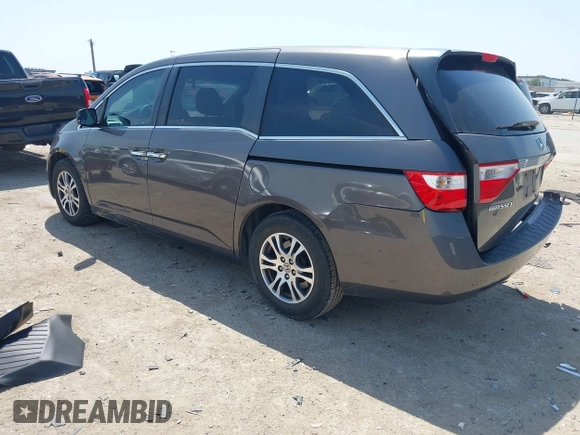 2012 Honda Odyssey EX with VIN 5FNRL5H41CB011940, listed as a IAAI auction lot 42033966 with 182,996 mi miles and . Bid and sale history available at DreamBid. Image 3.