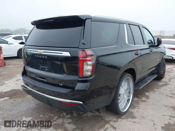 2021 Chevrolet Tahoe LT with VIN 1GNSCNKDXMR172381, listed as a IAAI auction lot 42168263 with 89,112 mi miles and . Bid and sale history available at DreamBid. Image 4.