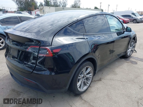 2023 Tesla Model Y Long Range z VIN 7SAYGDEE2PF863200, wystawiony jako IAAI lot #41805168 z przebiegiem 25 480 mil mil oraz . Historia ofert i sprzedaży dostępna na DreamBid. Obrazek 4.