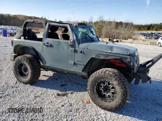 2014 Jeep Wrangler Sport z VIN 1C4AJWAG0EL119835, wystawiony jako Copart lot #88498755 z przebiegiem 151 756 mil mil oraz Szkoda całkowita • Salvage title. Historia ofert i sprzedaży dostępna na DreamBid. Obrazek 4.