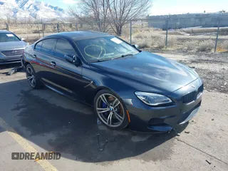 2017 BMW M6 z VIN WBS6E9C58HG437411, wystawiony jako IAAI lot #41636164 z przebiegiem 52 724 mil mil oraz . Historia ofert i sprzedaży dostępna na DreamBid. Obrazek 1.