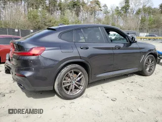 2019 BMW X4 M40i with VIN 5UXUJ5C5XKLJ64004, listed as a Copart auction lot 52106895 with 74,599 mi miles and Salvage title. Bid and sale history available at DreamBid. Image 3.
