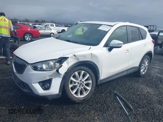 2015 Mazda CX-5 Grand Touring with VIN JM3KE4DY0F0483037, listed as a IAAI auction lot 41578222 with 102,988 mi miles. Bid and sale history available at carsss.com. Image 17.