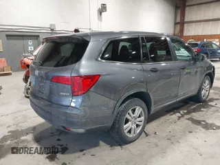 2016 Honda Pilot LX with VIN 5FNYF6H1XGB111488, listed as a IAAI auction lot 41581706 with 100,028 mi miles. Bid and sale history available at carsss.com. Image 4.